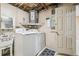 Convenient laundry room with washer, dryer, and utility sink at 3529 Windham Dr, Holiday, FL 34691