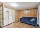Open living room with access to another room and tiled floors at 3529 Windham Dr, Holiday, FL 34691