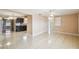 Open concept living room with tile floors and access to kitchen at 3529 Windham Dr, Holiday, FL 34691