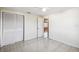 Bedroom with tile flooring, a double closet, and access to an adjacent room at 3529 Windham Dr, Holiday, FL 34691
