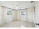 Bright, airy bedroom with tile flooring, a ceiling fan, and natural light at 3529 Windham Dr, Holiday, FL 34691