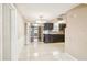 Open dining area featuring dark wood cabinets, tile flooring, and a decorative light fixture at 3529 Windham Dr, Holiday, FL 34691