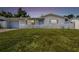 Charming one-story home with a neatly manicured lawn and classic white picket fence at 3529 Windham Dr, Holiday, FL 34691