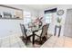 Bright dining area with a glass-top table and modern chairs at 3916 W Broad St, Tampa, FL 33614