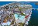 Wide aerial showcasing building, resort, and waterfront location at 399 2Nd St # 718, Indian Rocks Beach, FL 33785