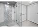 Updated bathroom with a walk-in shower, modern fixtures, and stylish tile work at 399 2Nd St # 718, Indian Rocks Beach, FL 33785
