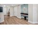 Condo entry with wood-look floors and built-in workspace at 399 2Nd St # 718, Indian Rocks Beach, FL 33785