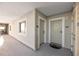 Condo hallway with doors to unit and window with water views at 399 2Nd St # 718, Indian Rocks Beach, FL 33785