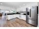 Modern kitchen with stainless steel appliances and granite countertops at 399 2Nd St # 718, Indian Rocks Beach, FL 33785
