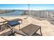 Relaxing community patio with lounge chairs and water views at 399 2Nd St # 718, Indian Rocks Beach, FL 33785