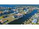 Aerial view showcasing home's waterfront location in a canal at 4294 Paradise Cir, Hernando Beach, FL 34607