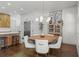 Casual dining area with round wooden table and white chairs at 518 Severn Ave, Tampa, FL 33606