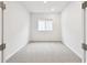 Small bedroom with neutral-colored carpet and a window at 5911 Jaudon Ave, Wesley Chapel, FL 33545