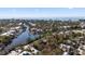 Aerial view of a neighborhood with waterfront access and lush trees at 675 Avenida Del Norte, Sarasota, FL 34242