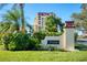 Welcoming building entrance with festive decor and courtyard at 700 Island Way # 206, Clearwater Beach, FL 33767