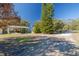Spacious backyard with covered patio and mature trees at 775 Pennsylvania Ave, Palm Harbor, FL 34683