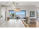 Bright dining area with water views and a stunning chandelier at 826 79Th S St, St Petersburg, FL 33707