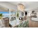 Elegant dining room with water views and a unique chandelier at 826 79Th S St, St Petersburg, FL 33707