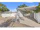 White carport and garage with covered storage area at 1322 48Th N Ave, St Petersburg, FL 33703