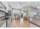 Bright kitchen with a dining area, white cabinets, and stainless steel appliances at 14433 Mirabelle Vista Cir, Tampa, FL 33626