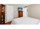 Bedroom with a comfortable bed and built-in shelving at 147 Bluff View Dr # 204, Belleair Bluffs, FL 33770