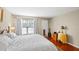 Main bedroom with king-size bed and hardwood floors at 147 Bluff View Dr # 204, Belleair Bluffs, FL 33770
