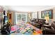 Living area with hardwood floors, leather furniture, and access to a balcony at 147 Bluff View Dr # 204, Belleair Bluffs, FL 33770