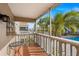 Screened balcony overlooking pool and tropical landscaping at 147 Bluff View Dr # 204, Belleair Bluffs, FL 33770