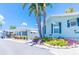 Community of mobile homes with lush landscaping and palm trees at 18675 Us Highway 19 N # 389, Clearwater, FL 33764