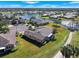 Aerial view of home, landscaping and golf course at 2493 Kensington Greens Dr # 2493, Sun City Center, FL 33573