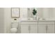 Double vanity bathroom with modern fixtures and stylish accents at 2625 Sunray Venus Way, Ruskin, FL 33570