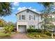 Two-story house with gray exterior and landscaping at 281 Ashley Ct, Dunedin, FL 34698