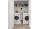 Laundry closet with washer and dryer, shelving at 281 Ashley Ct, Dunedin, FL 34698