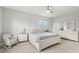 Spacious main bedroom with a white bed frame and rocking chair at 281 Ashley Ct, Dunedin, FL 34698