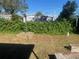 The backyard has a stone retaining wall at 2908 E 99Th Ave, Tampa, FL 33612