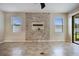 Gathering room featuring a tile floor and a stone accent wall at 4160 Little Gap Loop, Ellenton, FL 34222