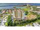 Stunning aerial view of the building, pool, surrounding waterways, and meticulously landscaped grounds at 501 Haben Blvd # 806, Palmetto, FL 34221