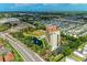 Luxury condo building with pool and pond, near a busy road at 501 Haben Blvd # 806, Palmetto, FL 34221