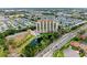Impressive aerial view highlighting the building's unique architecture, pond, and lush landscape at 501 Haben Blvd # 806, Palmetto, FL 34221