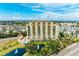 Elegant high-rise condo building with pool and pond at 501 Haben Blvd # 806, Palmetto, FL 34221