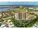 High-rise condo building near waterfront with lush landscaping at 501 Haben Blvd # 806, Palmetto, FL 34221