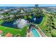 Aerial view showcasing pool, pond, and lush landscaping at 501 Haben Blvd # 806, Palmetto, FL 34221