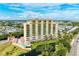Luxury condo building with resort-style pool and pond at 501 Haben Blvd # 806, Palmetto, FL 34221