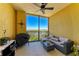 A covered patio with an outdoor seating area and a ceiling fan overlooking the city at 501 Haben Blvd # 806, Palmetto, FL 34221
