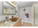A well lit bathroom featuring a sink with beautiful granite countertops and tile floors at 501 Haben Blvd # 806, Palmetto, FL 34221