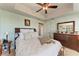 Bright bedroom with a queen-size bed and ceiling fan at 501 Haben Blvd # 806, Palmetto, FL 34221