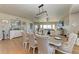 Beautiful dining room with table set for six people and modern chandelier at 501 Haben Blvd # 806, Palmetto, FL 34221