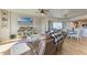 Comfortable living room with leather seating, TV, and seamless access to the kitchen at 501 Haben Blvd # 806, Palmetto, FL 34221