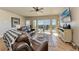 Cozy living room featuring comfortable seating, hardwood floors, and expansive windows showcasing beautiful views at 501 Haben Blvd # 806, Palmetto, FL 34221