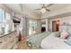 Bright and airy main bedroom features light-colored walls, shuttered windows, and a sliding door to the outside at 501 Haben Blvd # 806, Palmetto, FL 34221